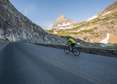 A cyclist on Going-to-the-Sun Road in Glacier National Park